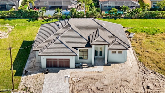 view of front of house with a garage and french doors