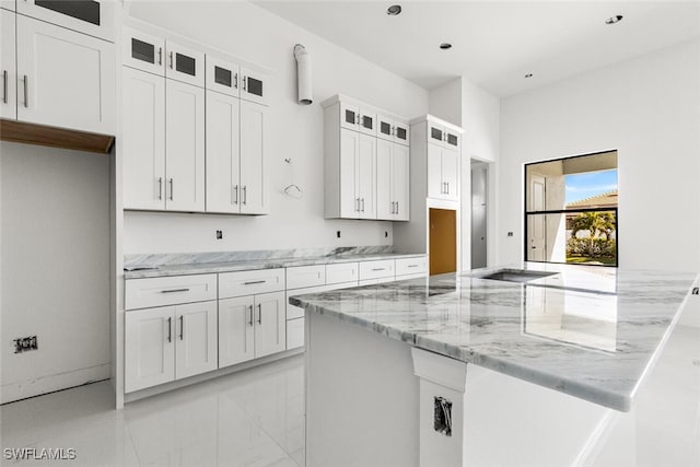 kitchen with white cabinets and light stone counters