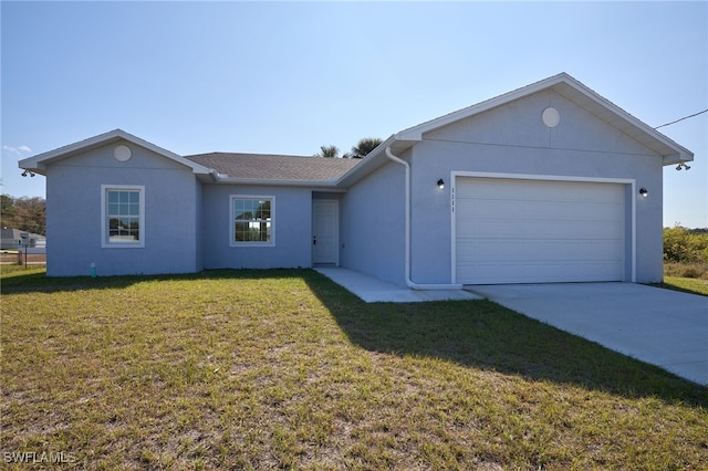 single story home with a front lawn and a garage