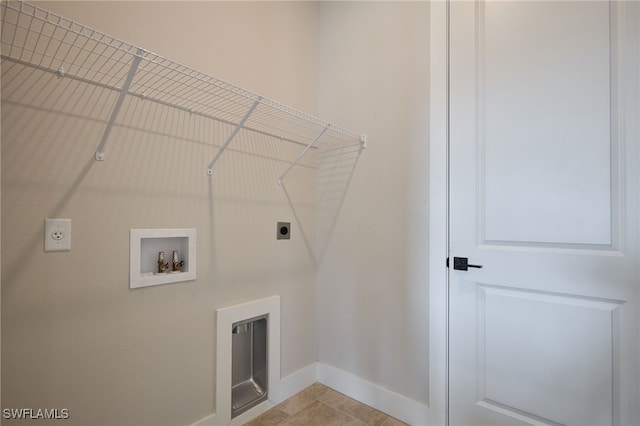 washroom featuring baseboards, washer hookup, laundry area, light tile patterned flooring, and hookup for an electric dryer