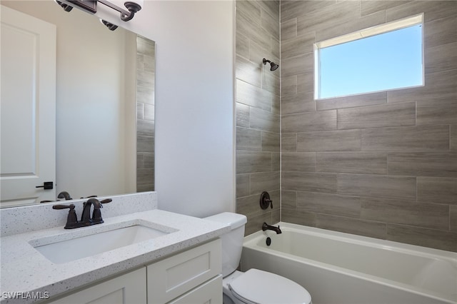 full bath featuring toilet, vanity, and washtub / shower combination