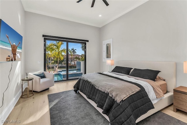 bedroom with hardwood / wood-style flooring, ceiling fan, and access to outside