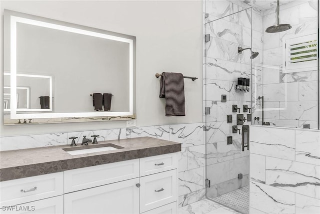 bathroom featuring vanity and a shower with shower door