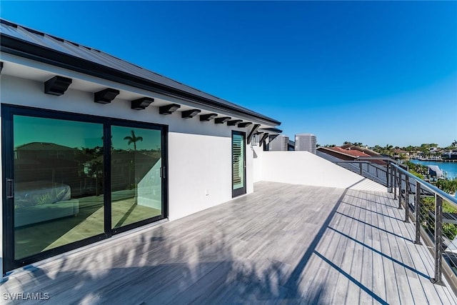 wooden deck featuring a water view