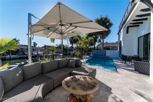 view of patio featuring a water view and an outdoor hangout area