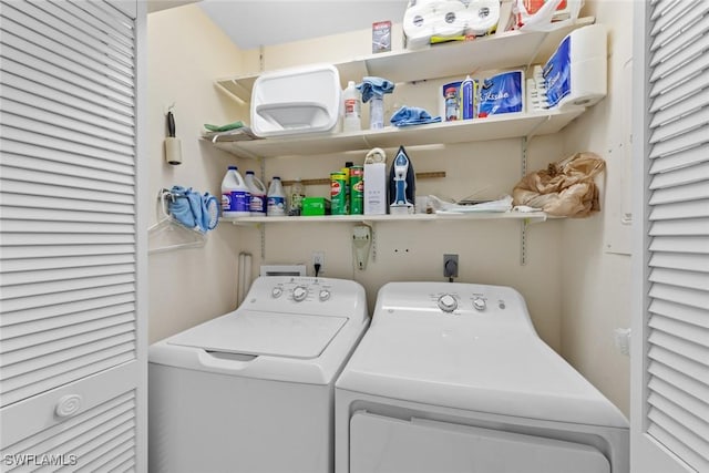 laundry room featuring separate washer and dryer