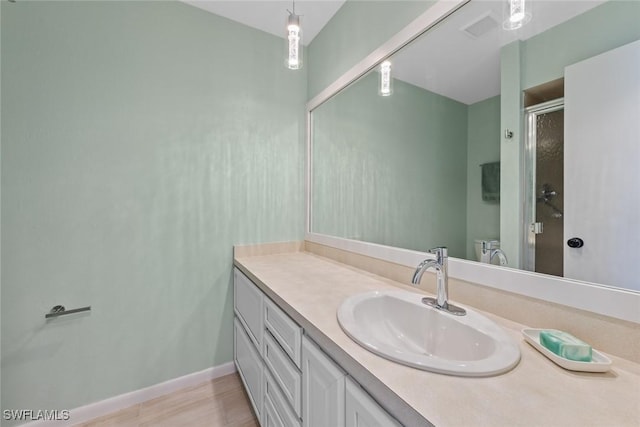 bathroom with vanity and walk in shower