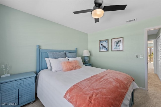 carpeted bedroom featuring ceiling fan