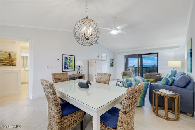 tiled dining area with ceiling fan with notable chandelier and vaulted ceiling