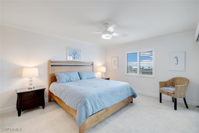 carpeted bedroom with ceiling fan and crown molding