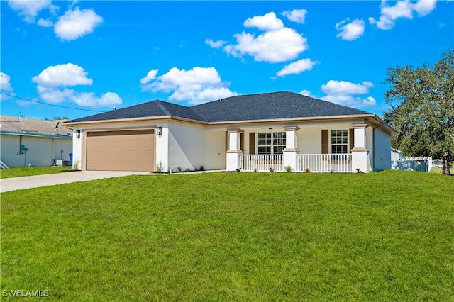 view of front of house with a garage, covered porch, and a front lawn