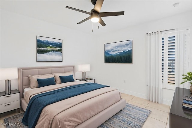 tiled bedroom featuring ceiling fan