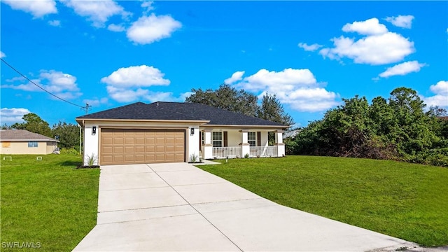 view of front of house with a garage, a front yard, and covered porch