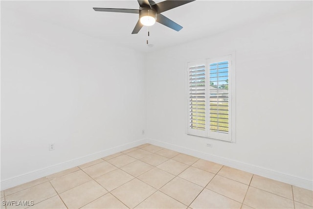 tiled empty room with ceiling fan