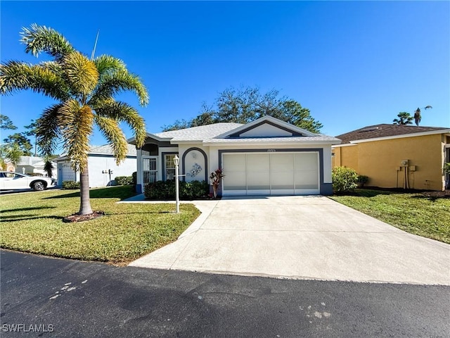 single story home featuring a garage and a front yard