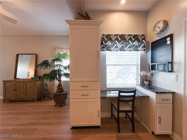 kitchen featuring white cabinetry and light wood-type flooring