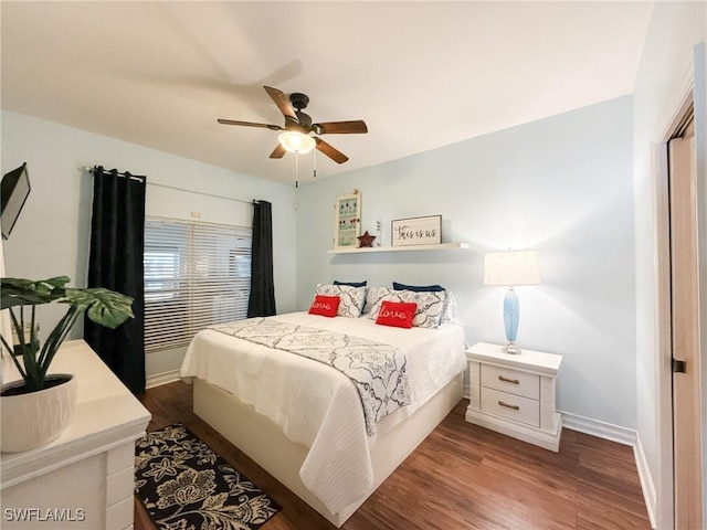 bedroom with dark wood-type flooring and ceiling fan