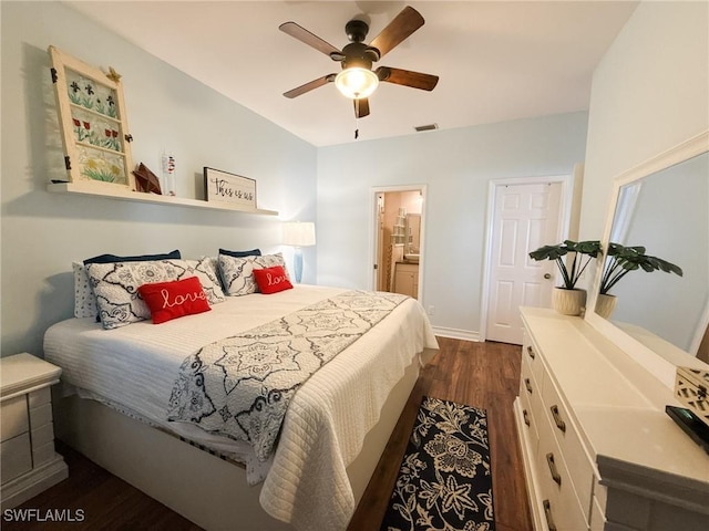 bedroom featuring dark wood-type flooring, ceiling fan, and ensuite bathroom