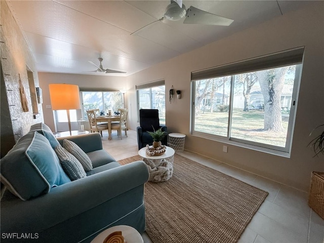 tiled living room featuring ceiling fan