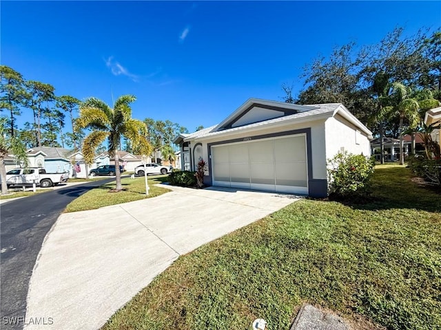 view of front of home featuring a garage and a front lawn