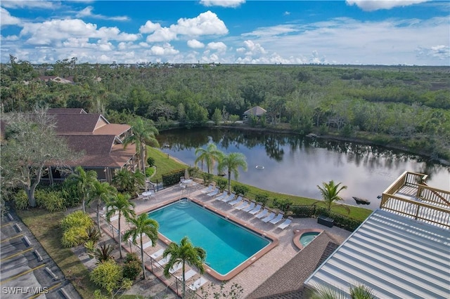 view of pool featuring a water view