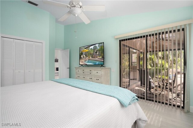 bedroom featuring access to exterior, vaulted ceiling, a closet, and ceiling fan