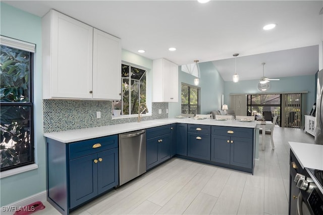 kitchen featuring dishwasher, kitchen peninsula, ceiling fan, blue cabinetry, and white cabinetry