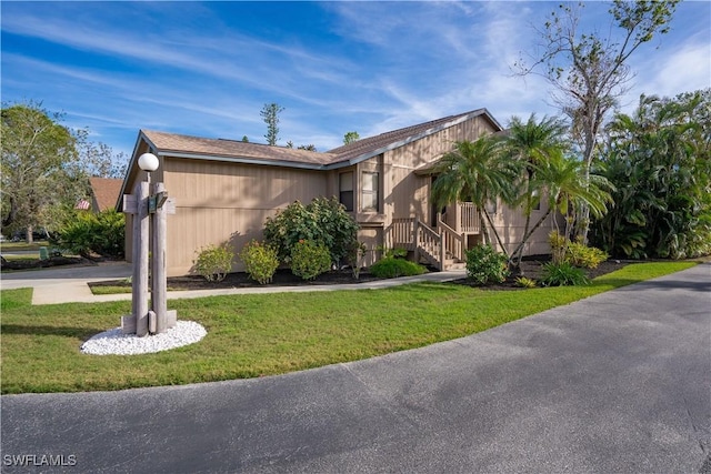 view of side of property featuring a lawn