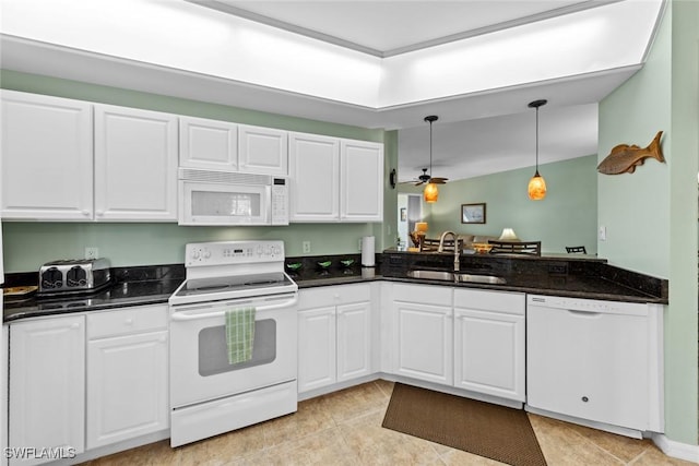 kitchen featuring ceiling fan, sink, pendant lighting, white appliances, and white cabinets