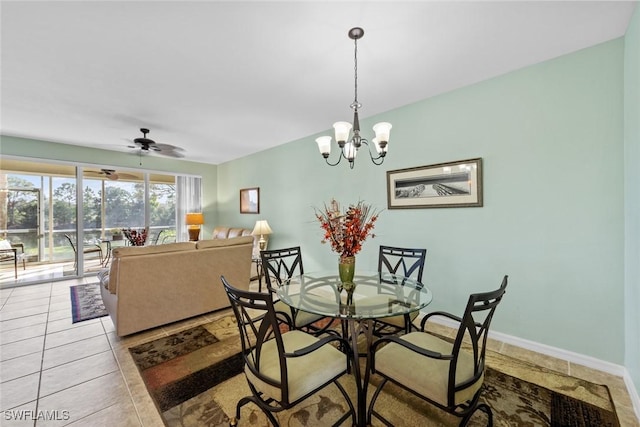 dining room with ceiling fan with notable chandelier and light tile patterned floors