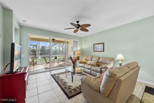 living room with ceiling fan and light tile patterned flooring