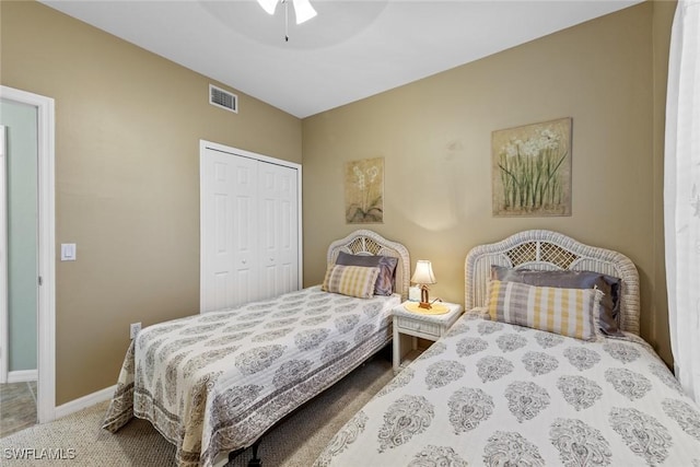 bedroom with ceiling fan, a closet, and carpet floors