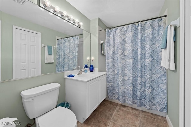 bathroom with walk in shower, vanity, and toilet