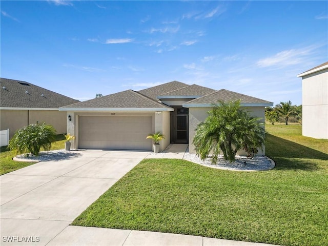 view of front of home featuring a front lawn and a garage