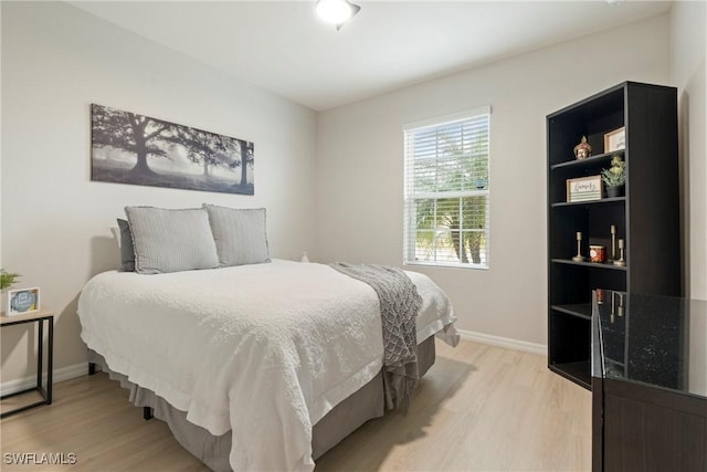 bedroom with light hardwood / wood-style flooring