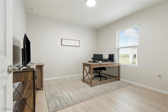 office area with light hardwood / wood-style flooring