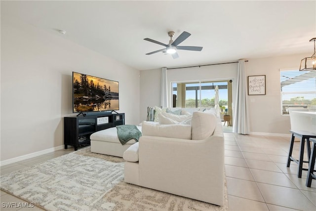 tiled living room featuring ceiling fan