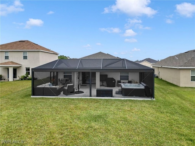 back of house featuring a lanai, a patio area, an outdoor hangout area, and a yard