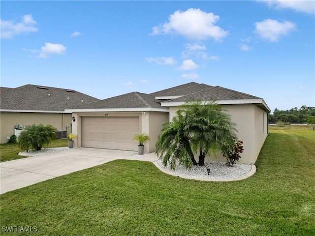 view of front facade with a garage, central air condition unit, and a front lawn