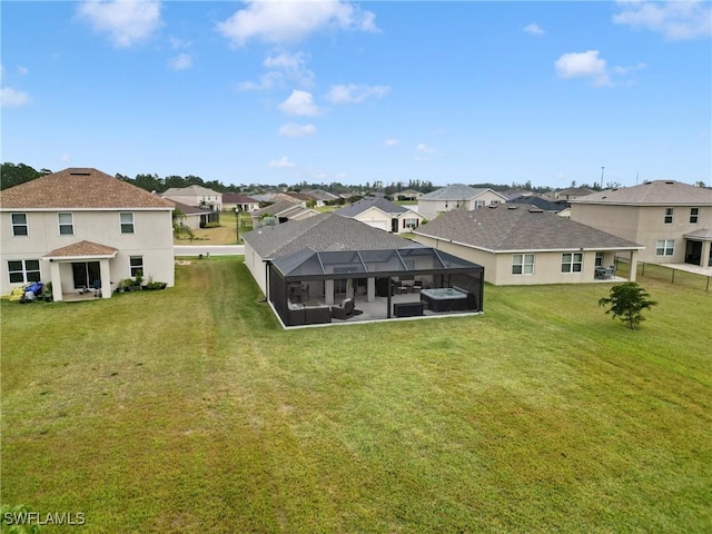 rear view of property featuring glass enclosure and a yard