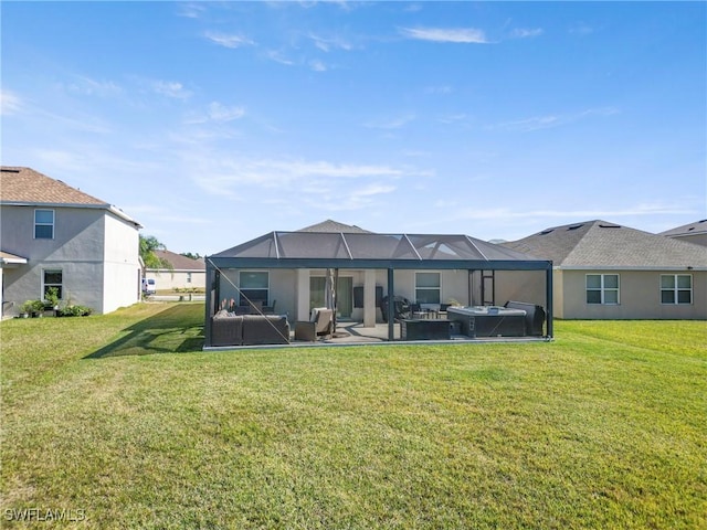 rear view of house featuring an outdoor hangout area, a patio area, a lanai, and a yard