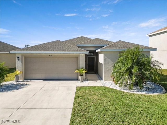 view of front facade with a front lawn and a garage