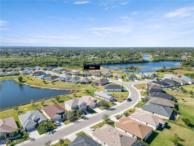 drone / aerial view with a water view