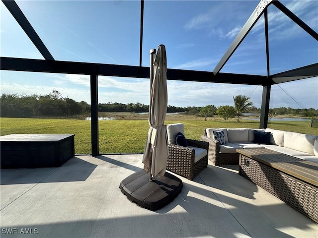 view of patio / terrace with a water view and an outdoor hangout area