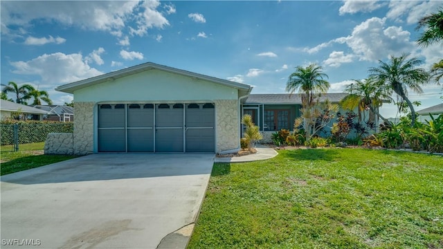 single story home with a front yard and a garage