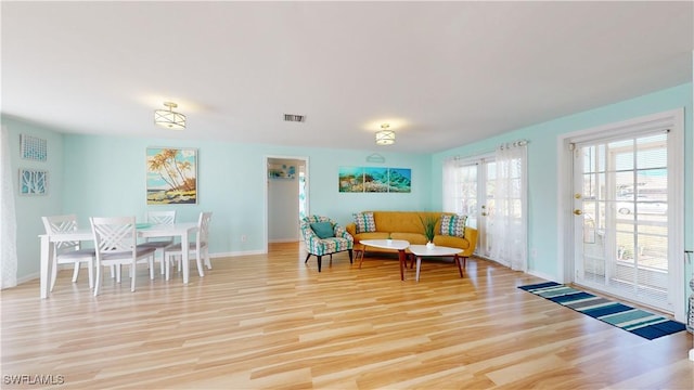 interior space featuring light wood-type flooring and french doors