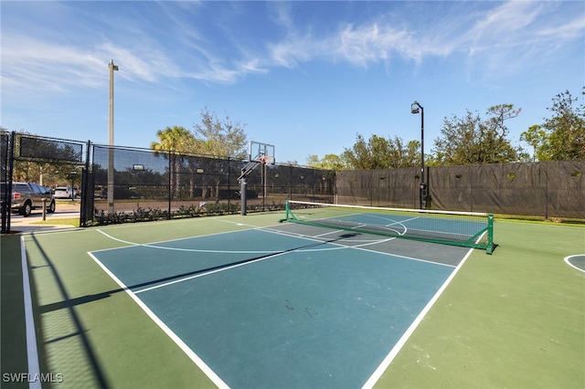 view of basketball court featuring tennis court