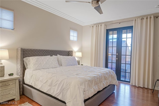 bedroom featuring ceiling fan, french doors, crown molding, wood-type flooring, and access to outside