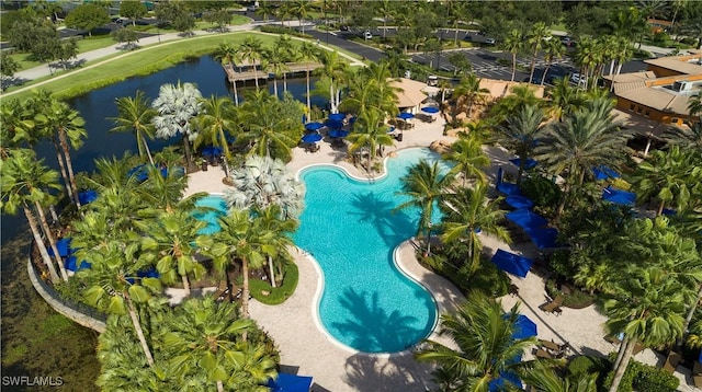 birds eye view of property with a water view