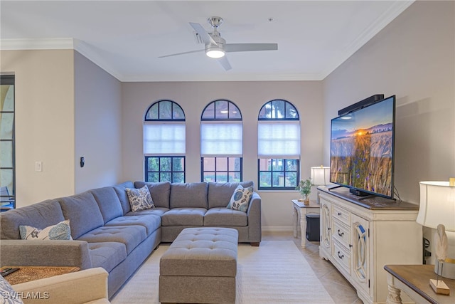 tiled living room with ceiling fan and ornamental molding